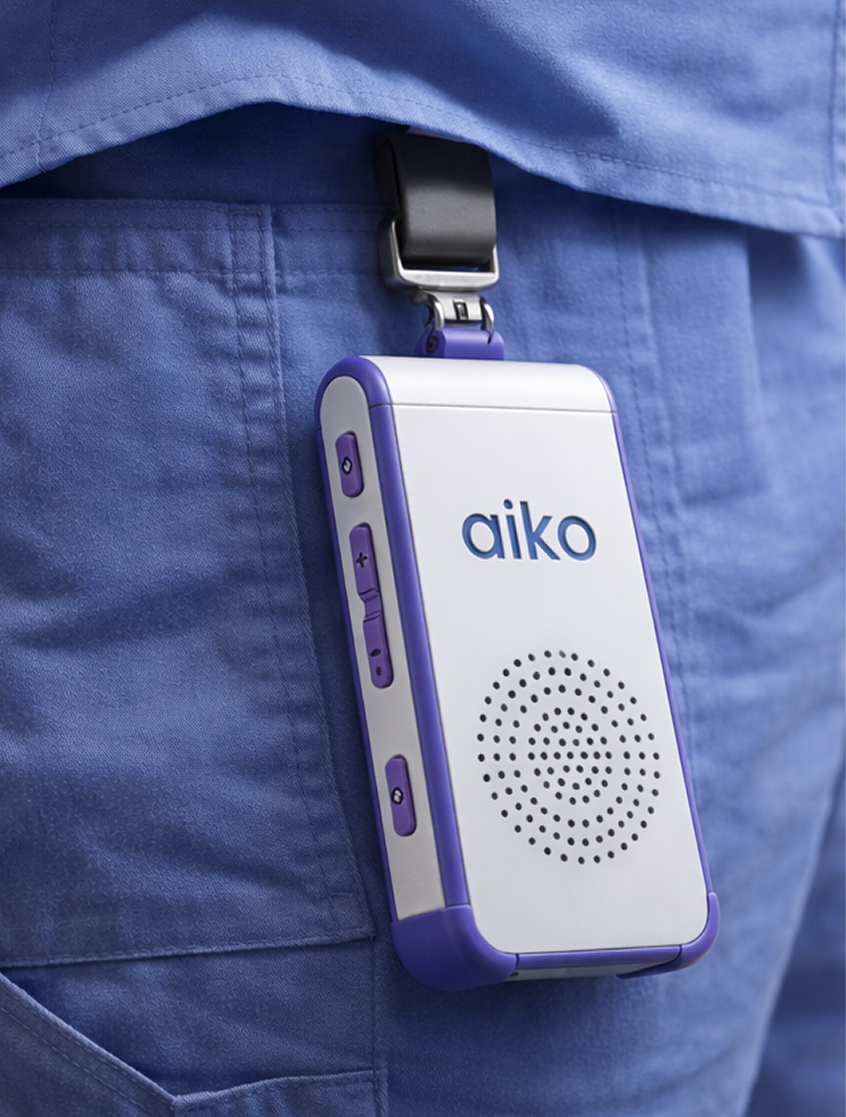 Aiko device clipped to caregiver clothing